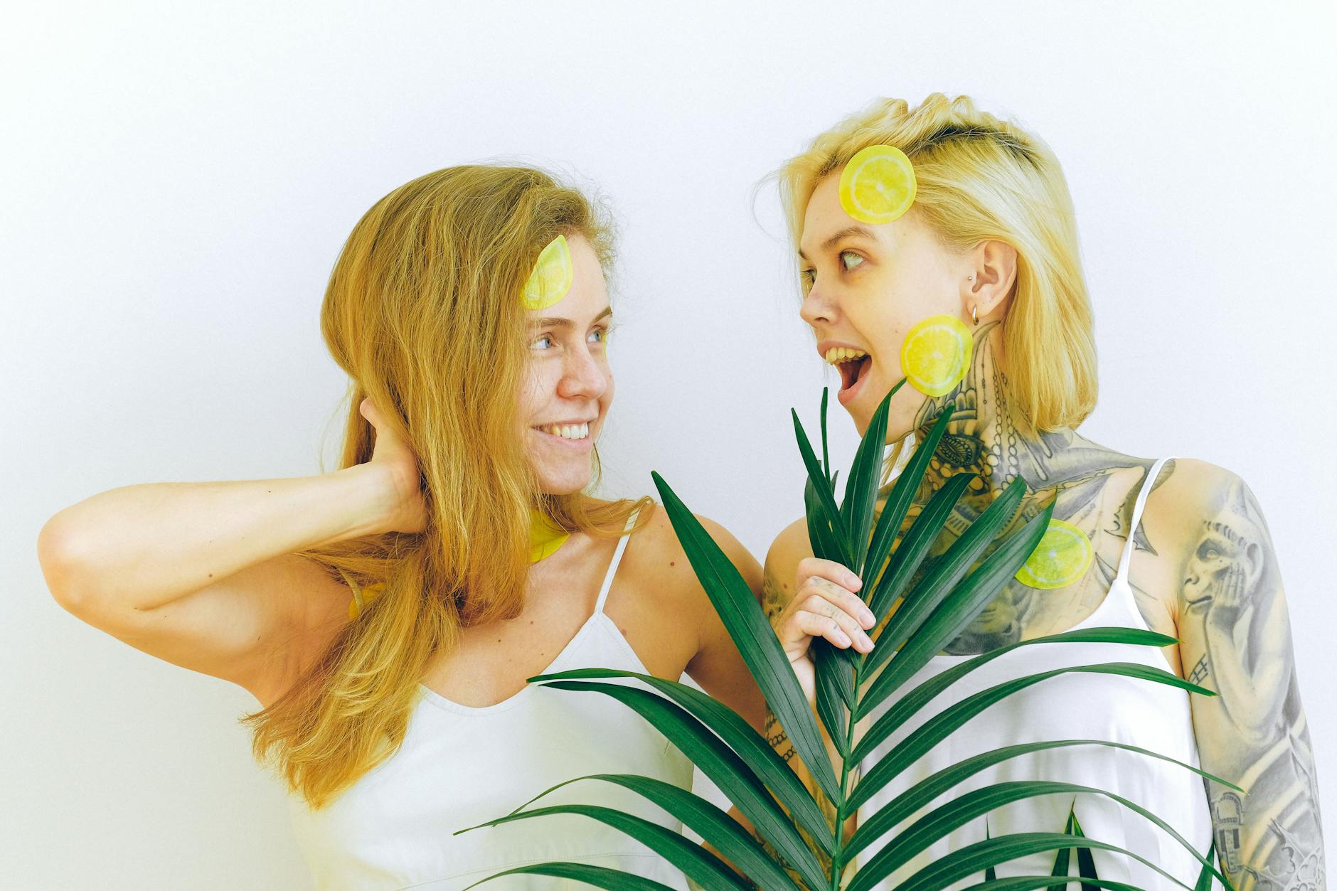 Two smiling women expressing joy and wellness indoors