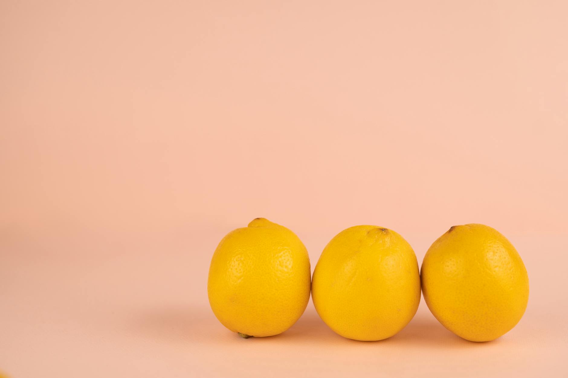 Vibrant collection of colorful clitoral vibrators and massagers arranged on a bright yellow surface